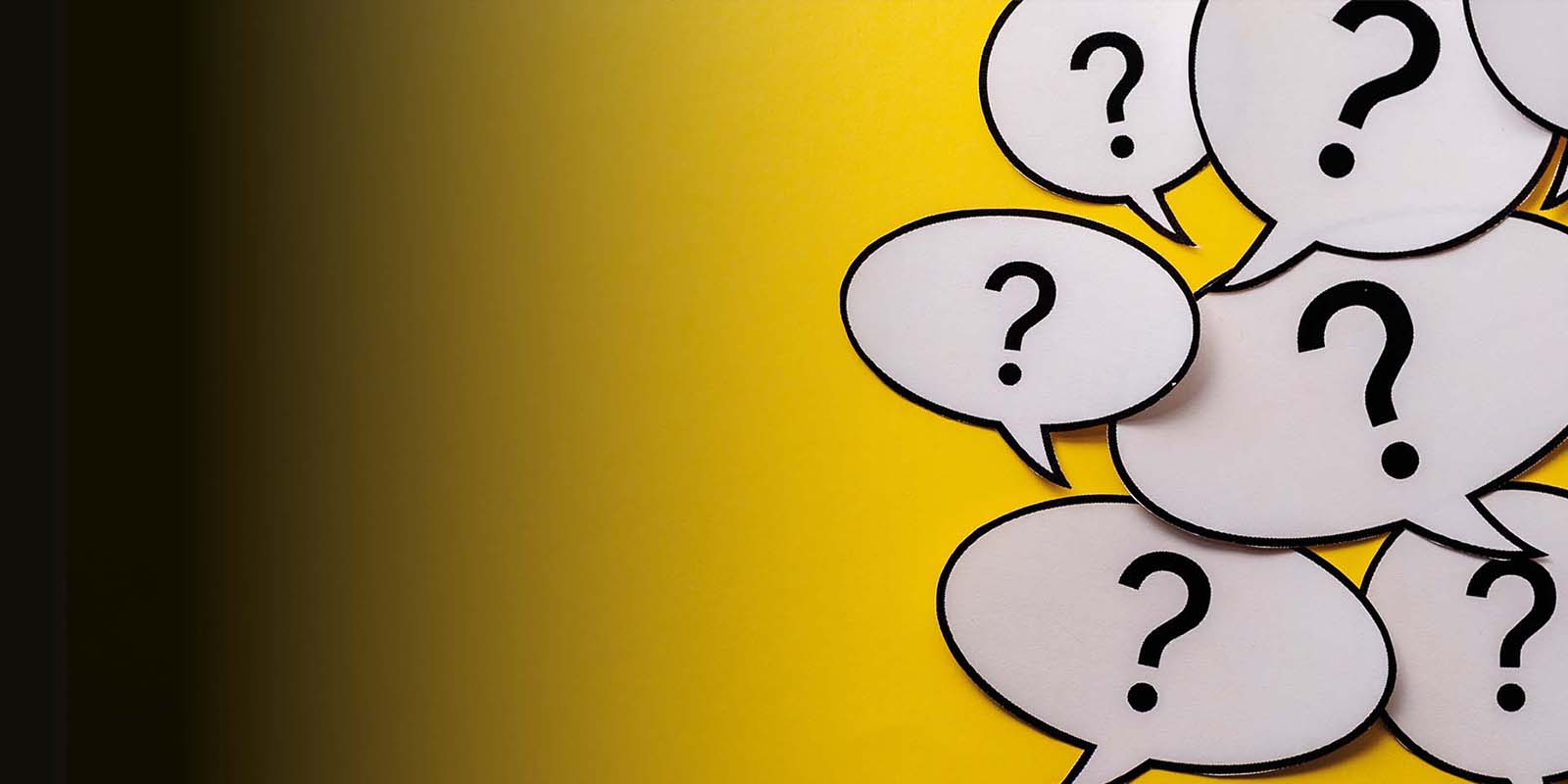 Multiple question marks in speech bubbles on a yellow background